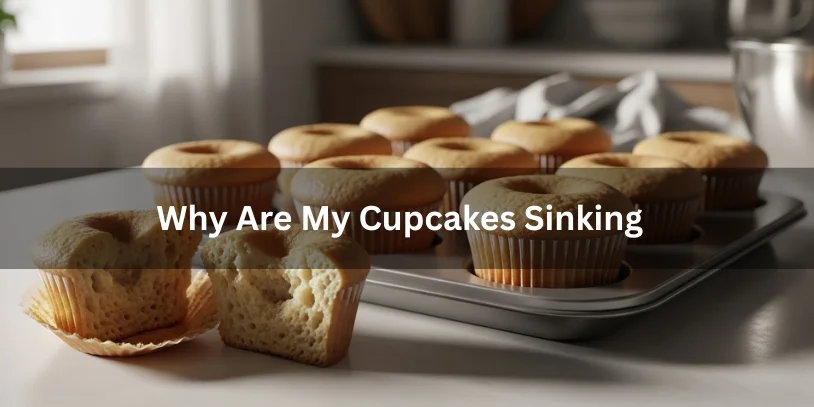 A tray of sunken cupcakes sits on a kitchen counter. Sunlight streams through a window, creating a soft, contemplative mood. Text: "Why Are My Cupcakes Sinking."-why are my cupcakes sinking