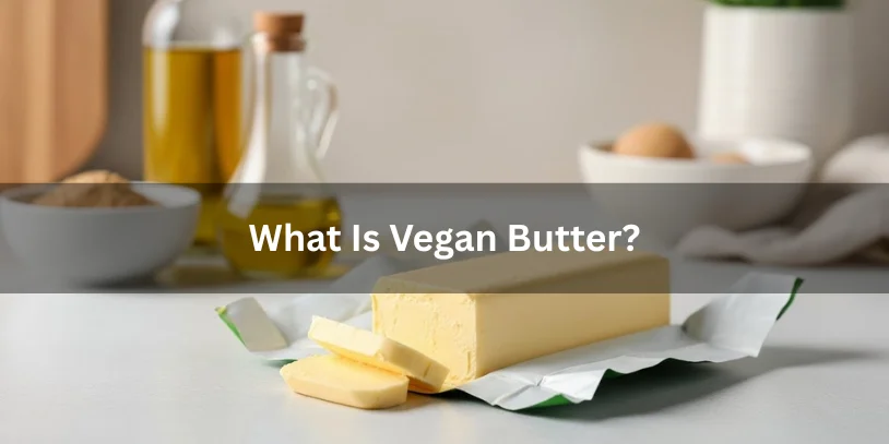 A stick of vegan butter partially unwrapped with a pat sliced, ingredients like plant-based oils in the background, realistic food photography explaining what vegan butter is.-best vegan butter for baking 