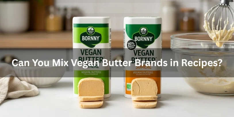 Two different vegan butter sticks side by side with small pats sliced, mixing bowl with partially mixed batter nearby, realistic food photography illustrating whether you can mix vegan butter brands in recipes-best vegan butter for baking 
