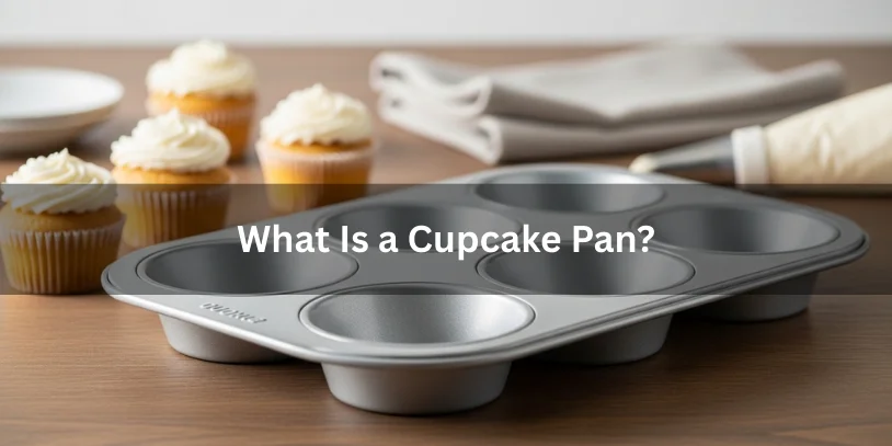 Standard cupcake pan with shallow cups and frosted cupcakes nearby, showing what a cupcake pan is used for.-muffin pan vs cupcake pan 