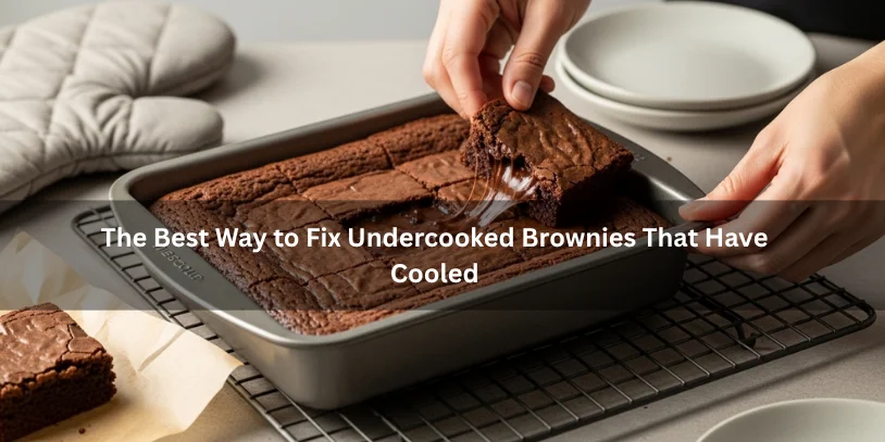 Cooled brownie pan with a soft underbaked center and cut section showing a gooey interior, illustrating the best way to fix undercooked brownies that have cooled under soft natural lighting.-how to fix undercooked brownies that have cooled 