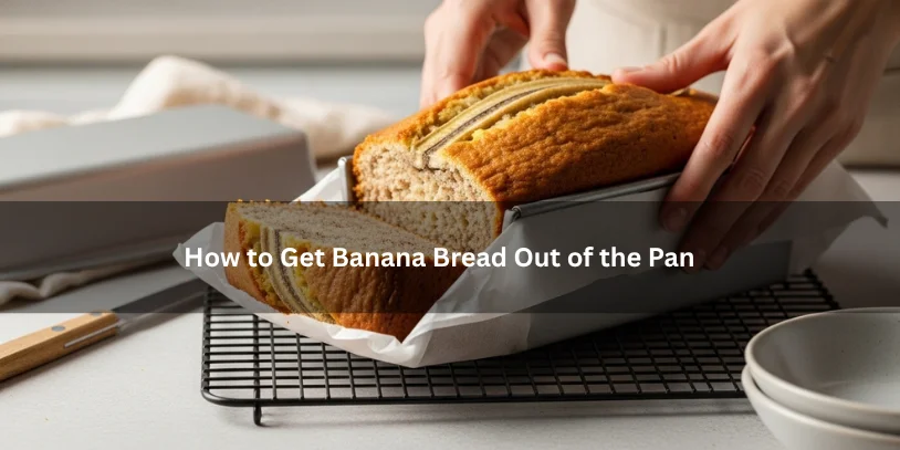 Freshly baked banana bread being carefully lifted from a loaf pan onto a cooling rack, illustrating how to get banana bread out of the pan under soft natural lighting.-how to get banana bread out of the pan